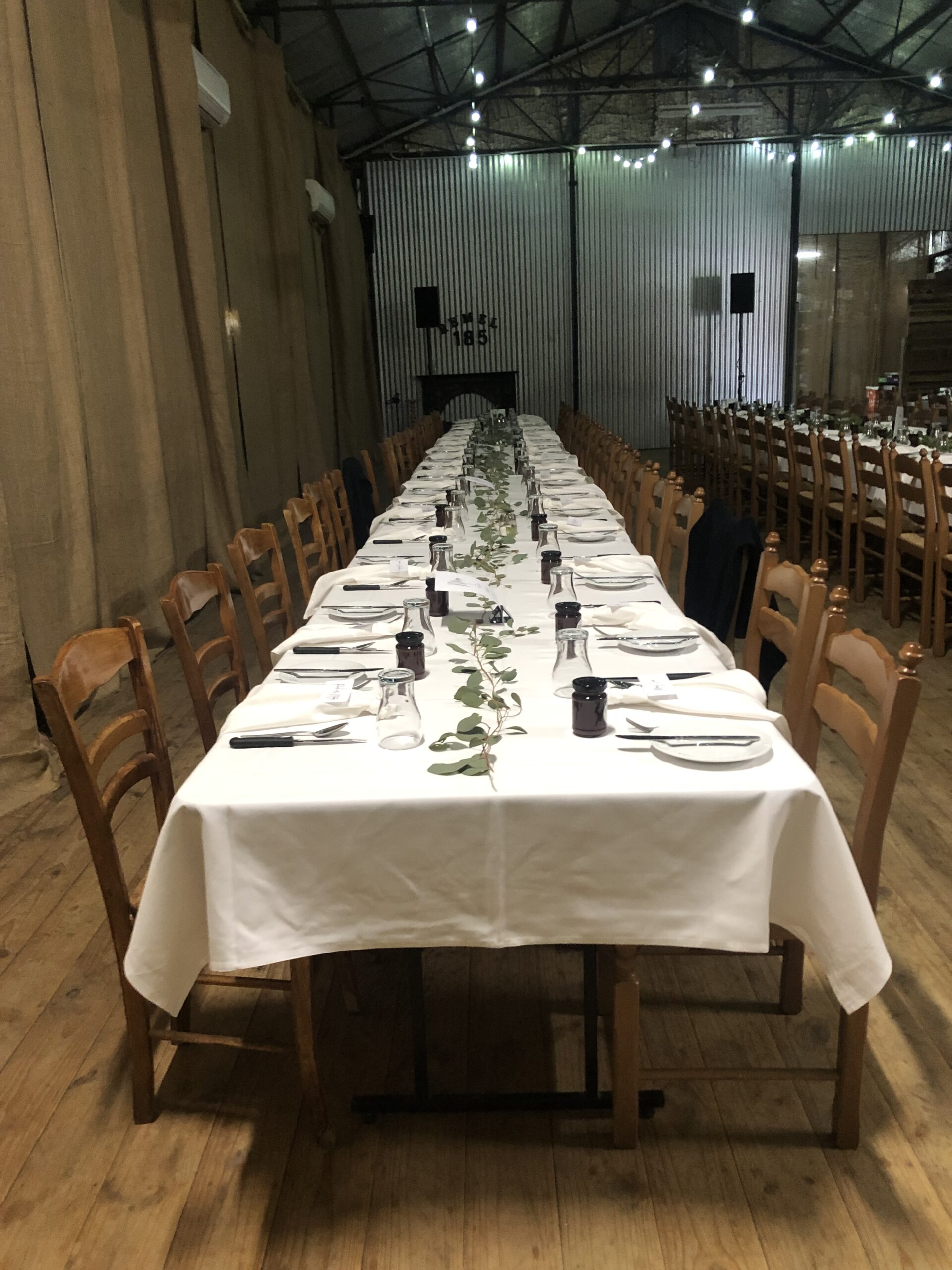 Long table set down the centre of the shed